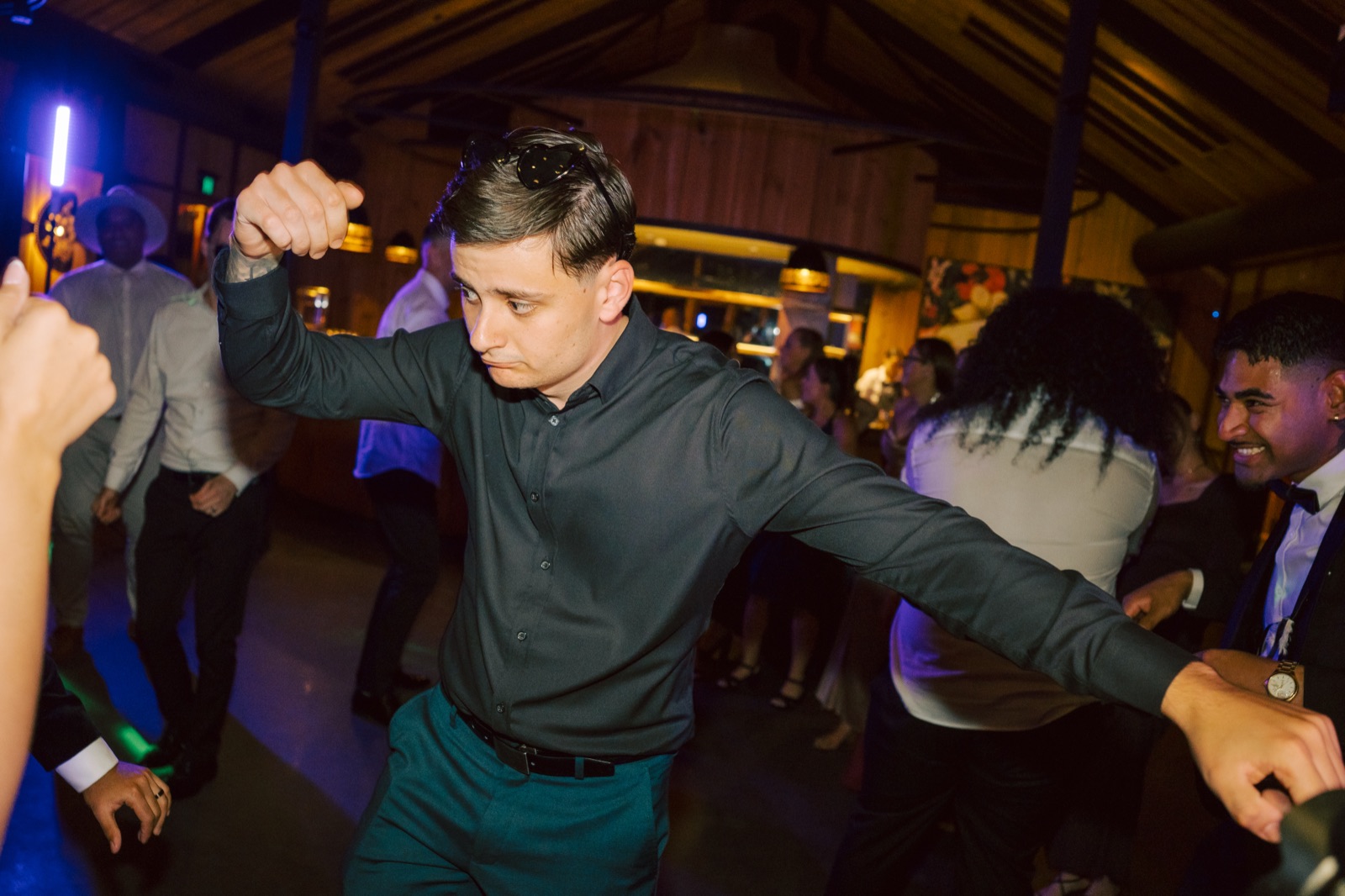 A guest dancing under the lights